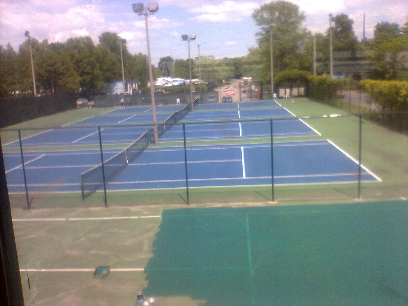 Outdoor tennis court setting — representative view for Melbourne Park, Vancouver