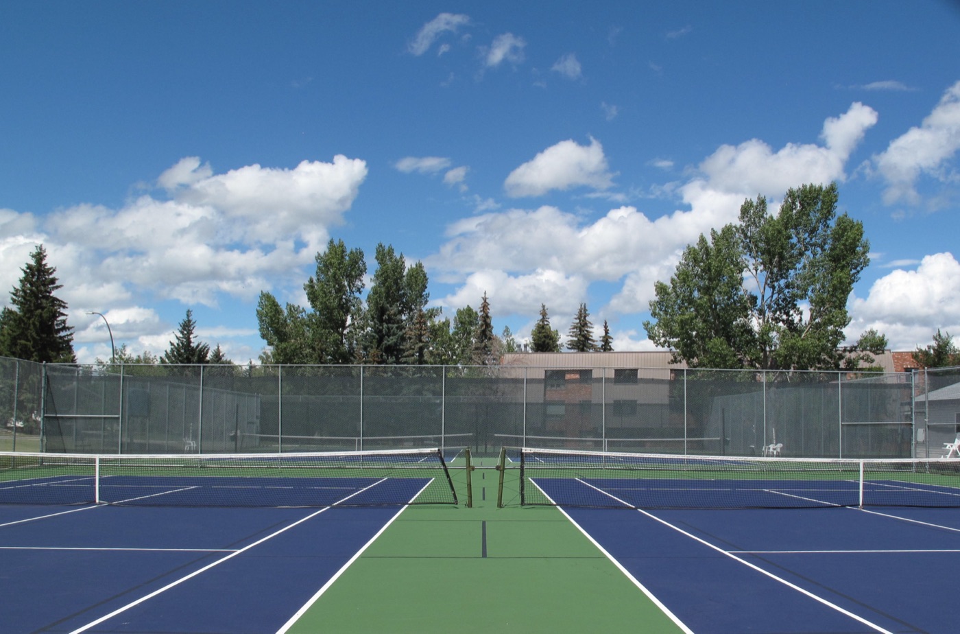 Outdoor tennis court setting — representative view for Stanley Park, Vancouver