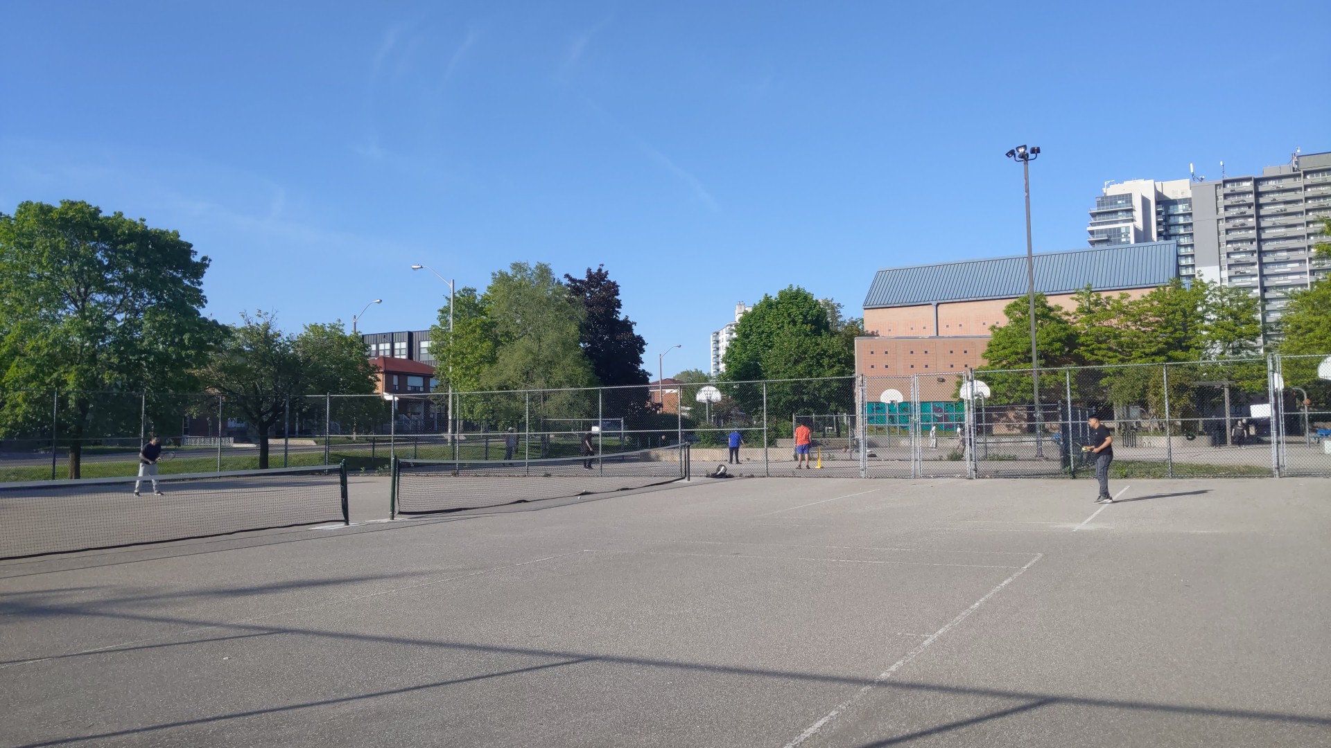 Doubles pickleball match on the outdoor court at Amesbury Park, Toronto