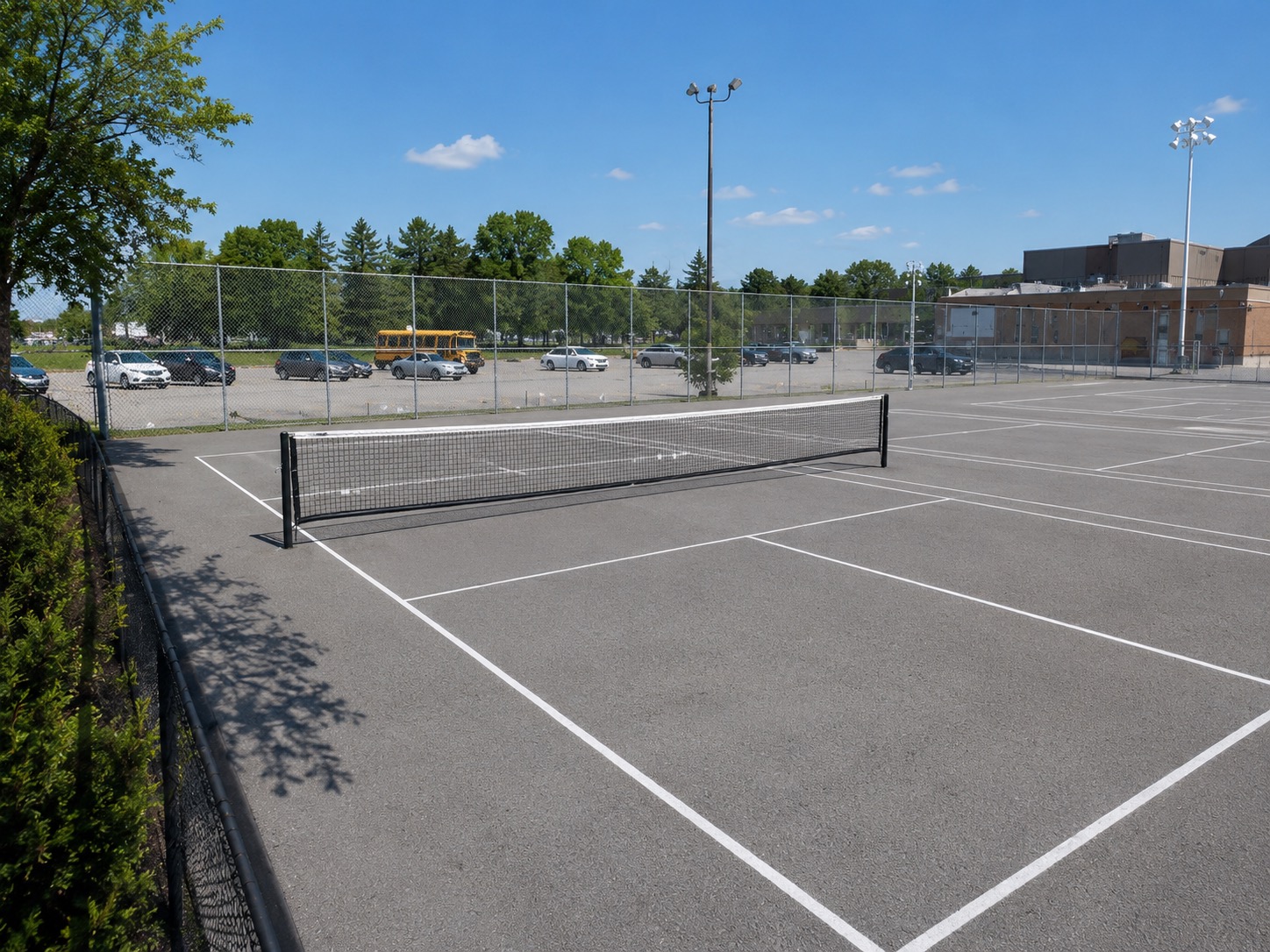 Outdoor pickleball courts at Angela James Arena & Tennis Courts — empty court overview, Toronto