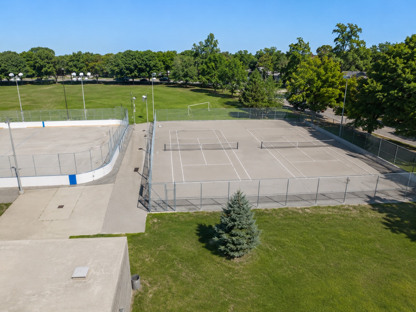 Outdoor pickleball courts at Jimmie Simpson Park — empty court overview, Toronto