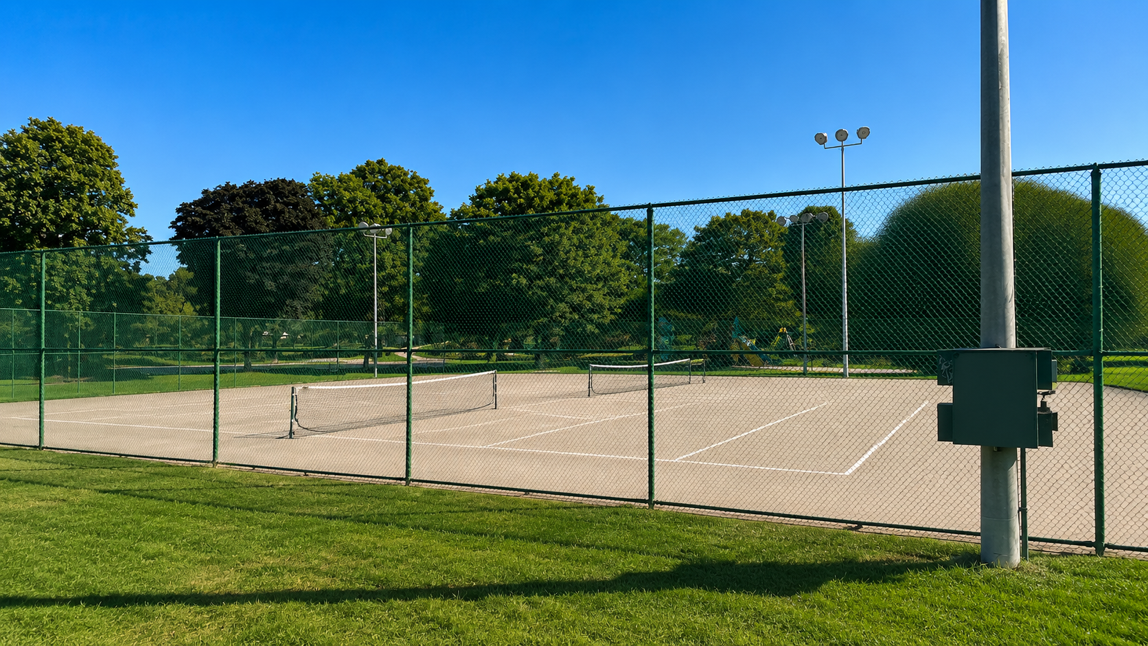 Outdoor pickleball courts at Lora Hill Park — empty court overview, Toronto